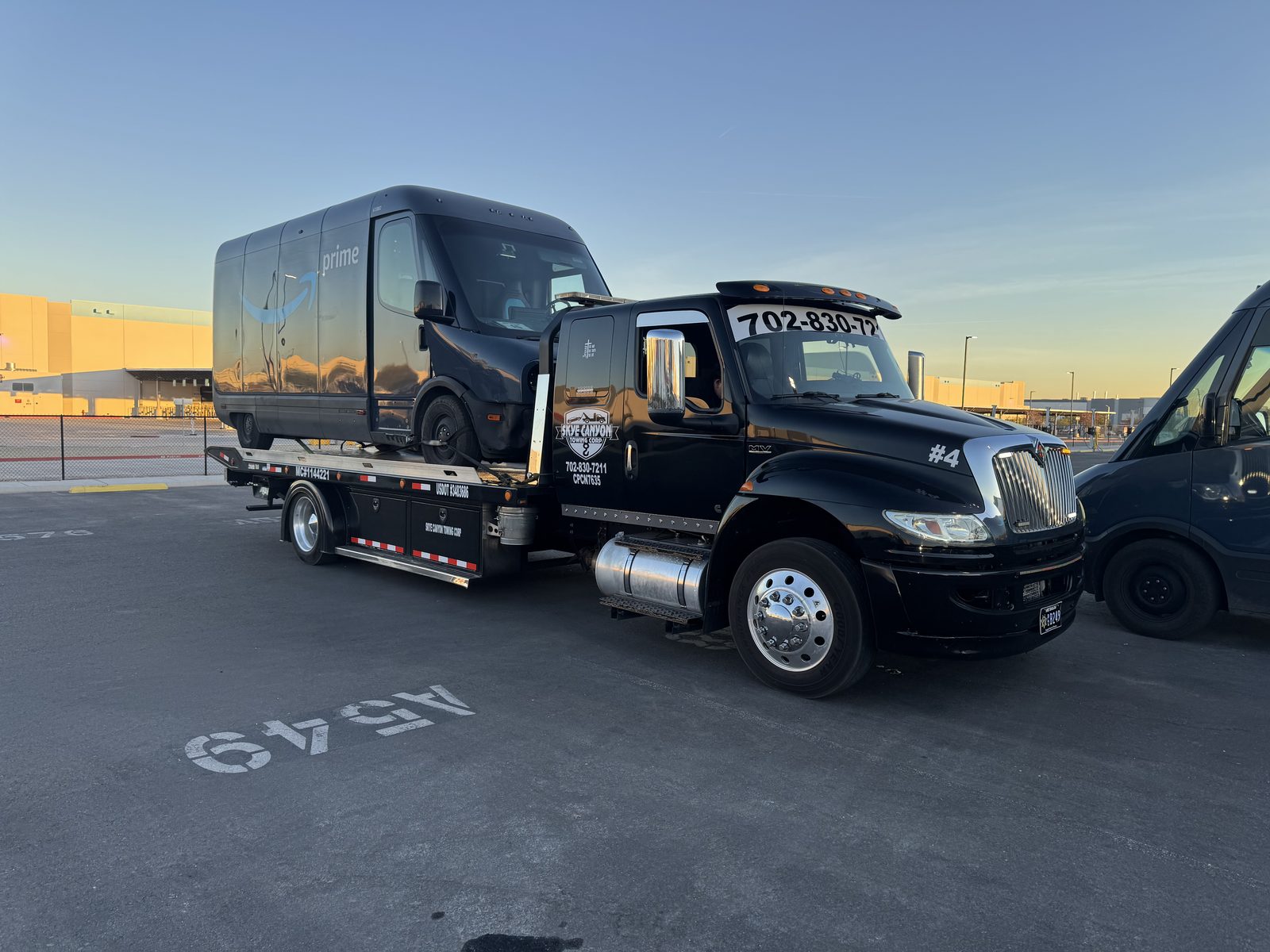 Amazon electric delivery van on a Skye Canyon Towing flatbed in Las Vegas